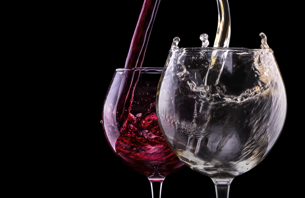 Elegant red wine glass  in black background